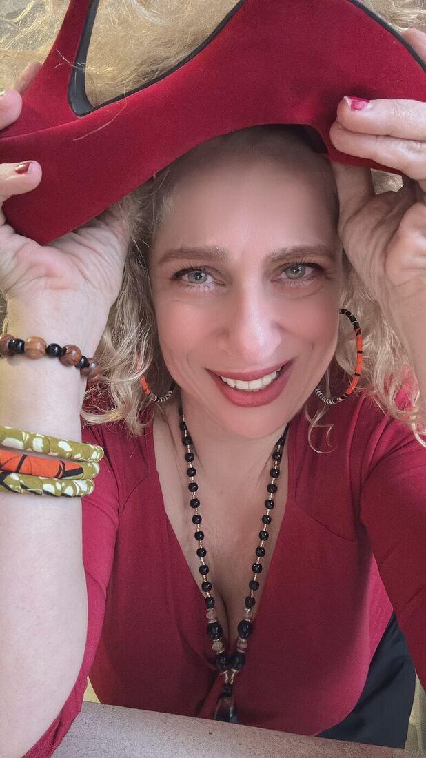 A woman wearing the wrapped hoop earrings.