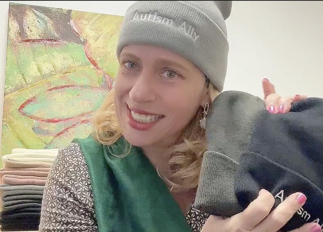 Beanies being sorted and folded in the workroom.